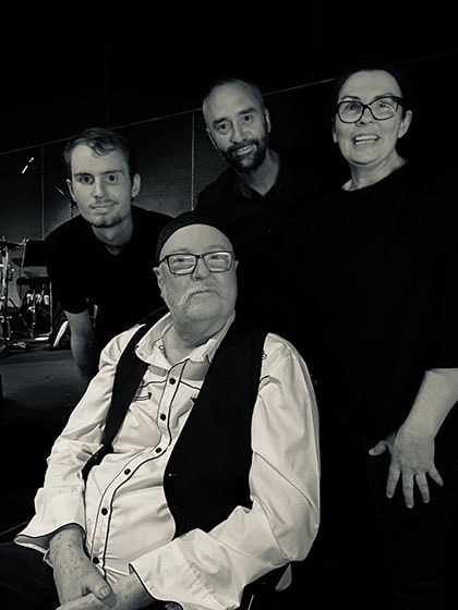 (L-R) Sam, Errol, Sandie’s brother Jamie, and Sandie at the launch of Errol’s 2021 album. Errol was able to leave hospital to perform on stage with Sam for the first time.