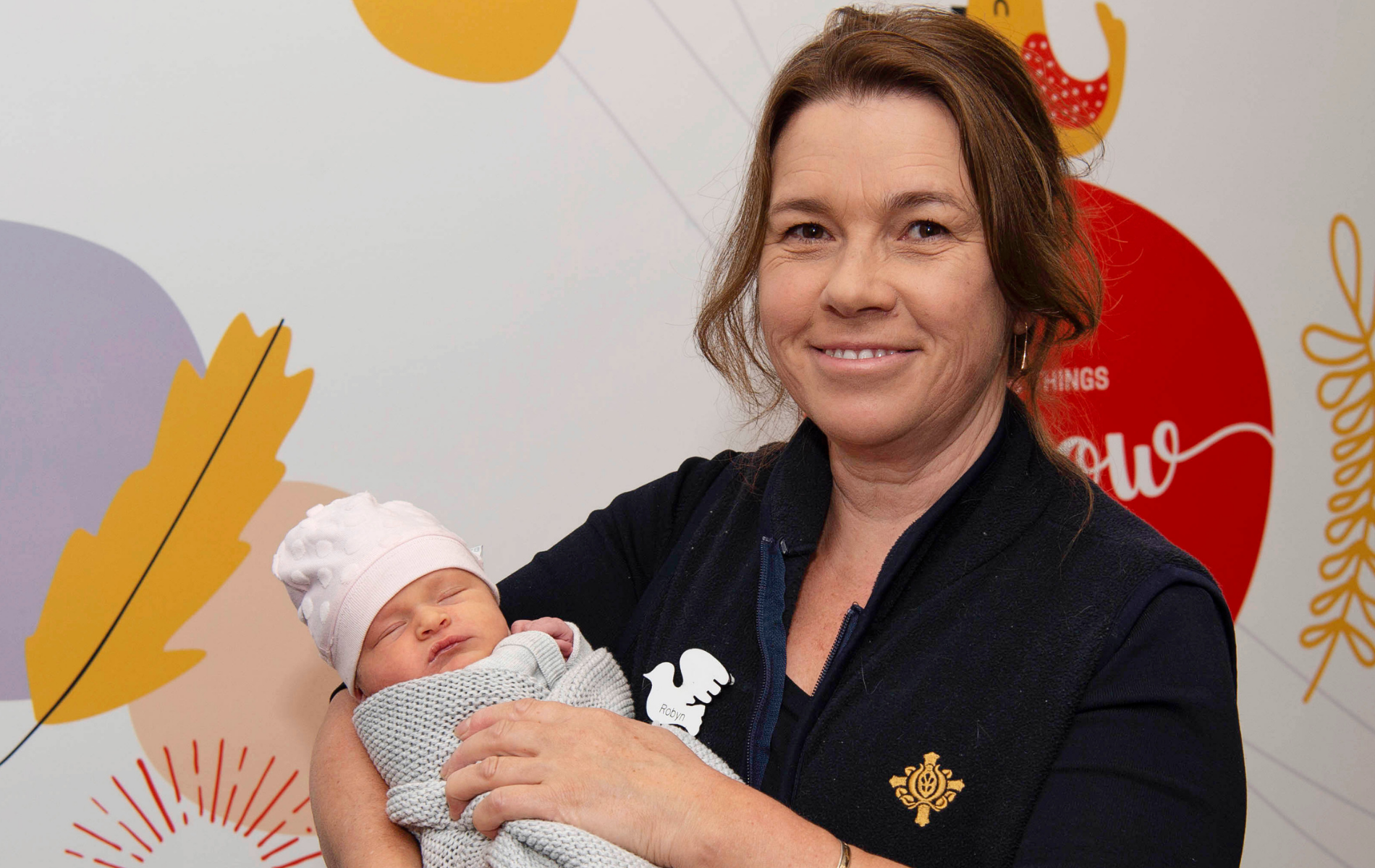 Caregiver holding baby