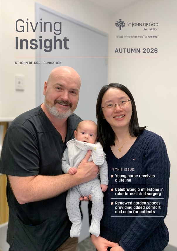 The front of a magazine with the title 'Giving Insight". On the cover we can see a man and a woman holding a baby