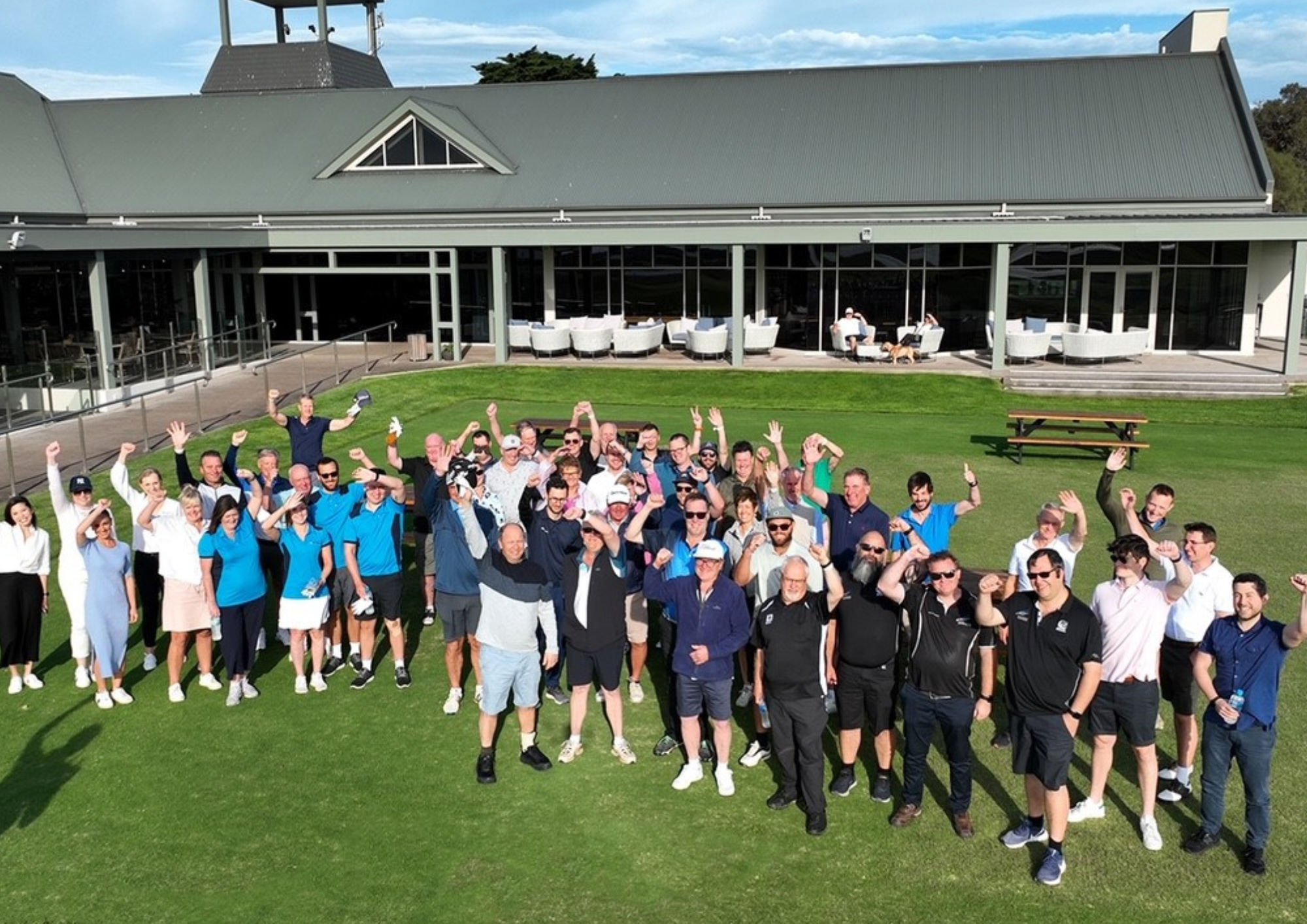 Golfers standing on green