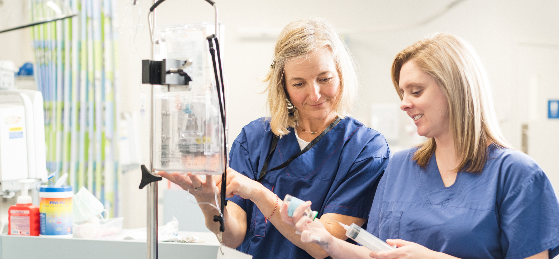 Two Subiaco hospital caregivers smiling while working 