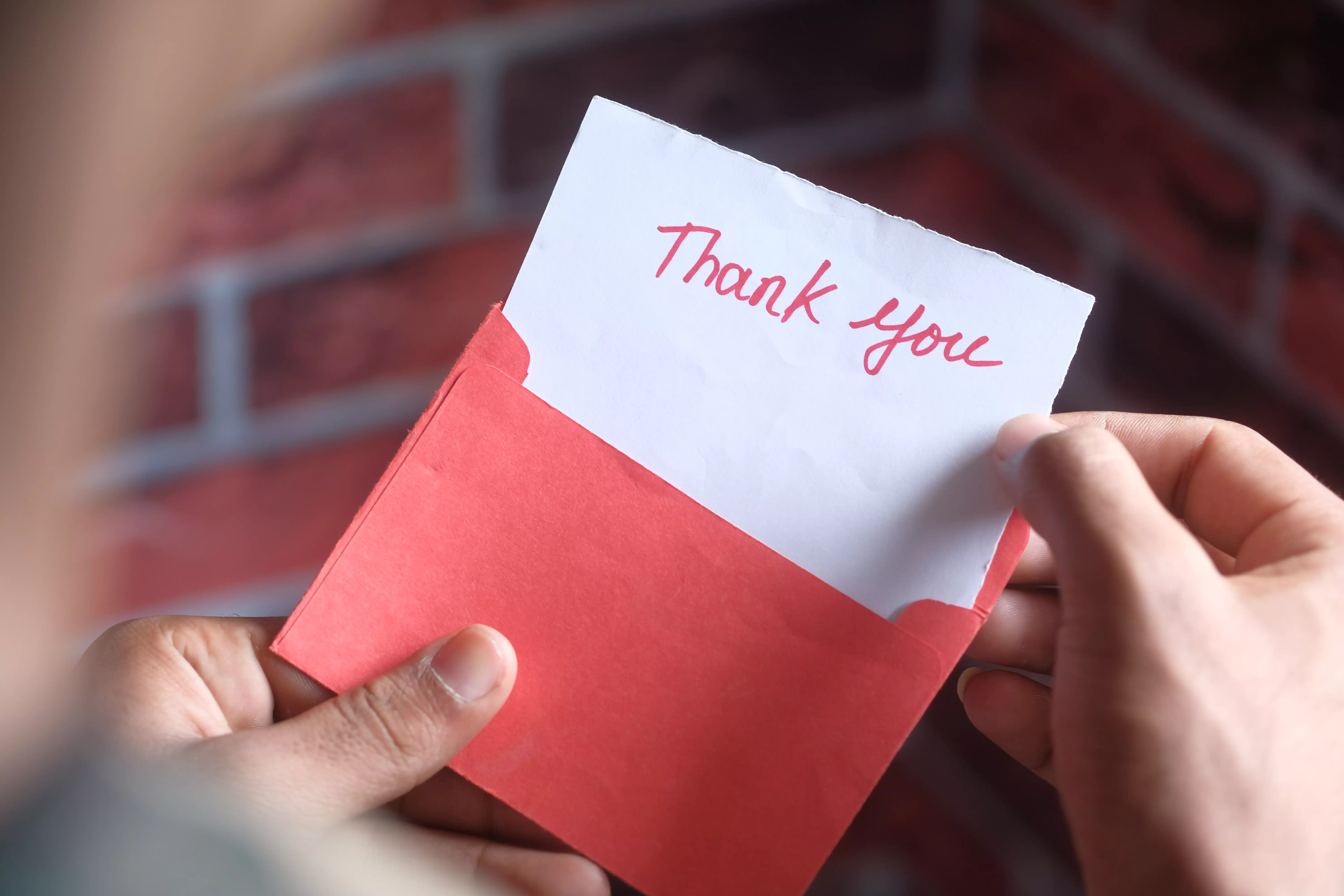 Thank you card in red envelope.